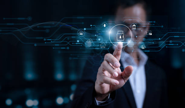 A business professional's hand is shown pointing at a glowing padlock icon on a digital interface. The interface is surrounded by a circuit-like pattern and various other security and data icons.