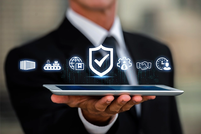 Business professional holding a tablet with digital icons of security, automation, and global connectivity, representing cybersecurity, IT strategy, and managed services by Elevate Technology.