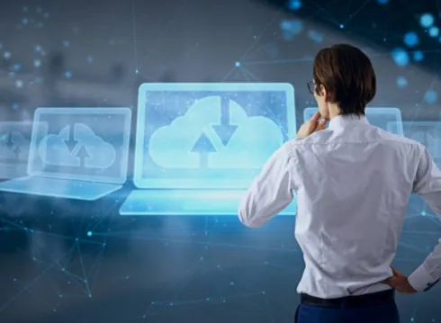 A person looking at a digital interface showing cloud storage and data synchronization.