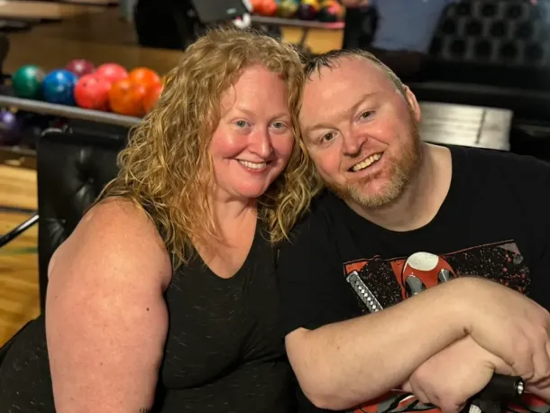 Smiling colleagues at a bowling event, representing the team behind Elevate Technology and their mobile turnkey IT Services.