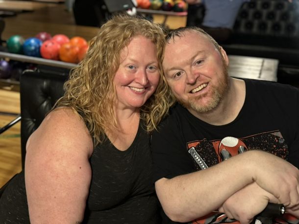 Smiling colleagues at a bowling event, representing the team behind Elevate Technology and their mobile turnkey IT Services.