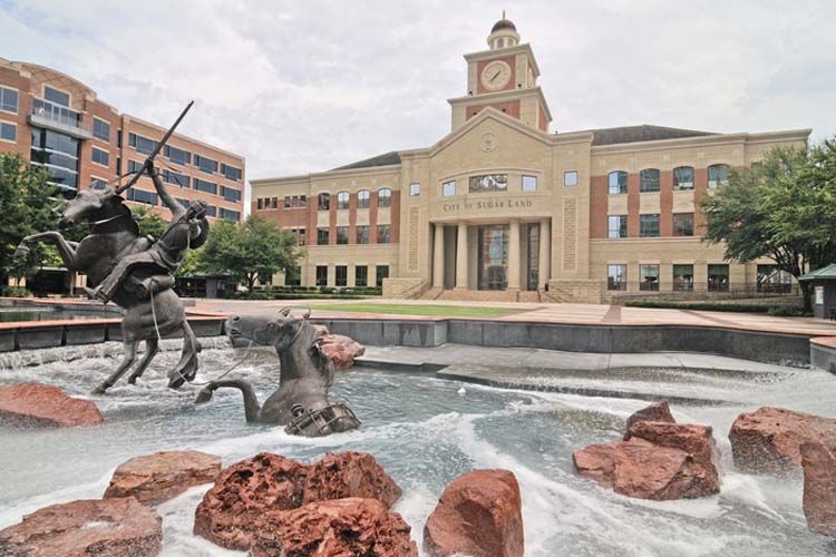 Statue and fountain in front of Sugar Land City Hall in Sugar Land, Texas, representing Elevate Technology’s local IT support, cybersecurity, and managed IT services for businesses in Sugar Land.