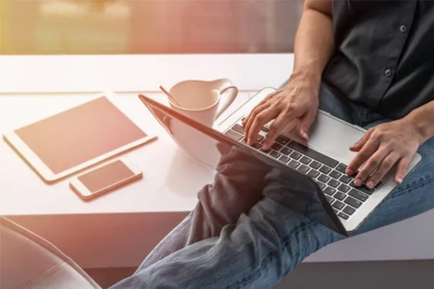 A five-star Google review for Elevate Technology from Jody Tuinier, an Office Manager. Her profile image shows her smiling, and the accompanying text praises the company's employees for going "above and beyond" and for being "available 24/7.